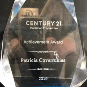 A plaque that says century 2 1 parisher properties achievement award.