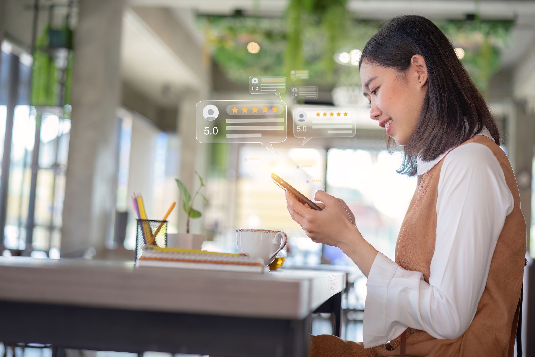 Close up of customer writing reviews, hand pressing on a smartphone screen with a golden five star rating feedback icon. Concept of rating and feedback for evaluation