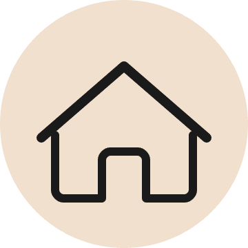Minimalist house icon in a circular design.